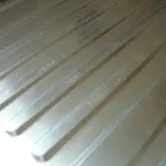 Scratched stainless steel sink before repair